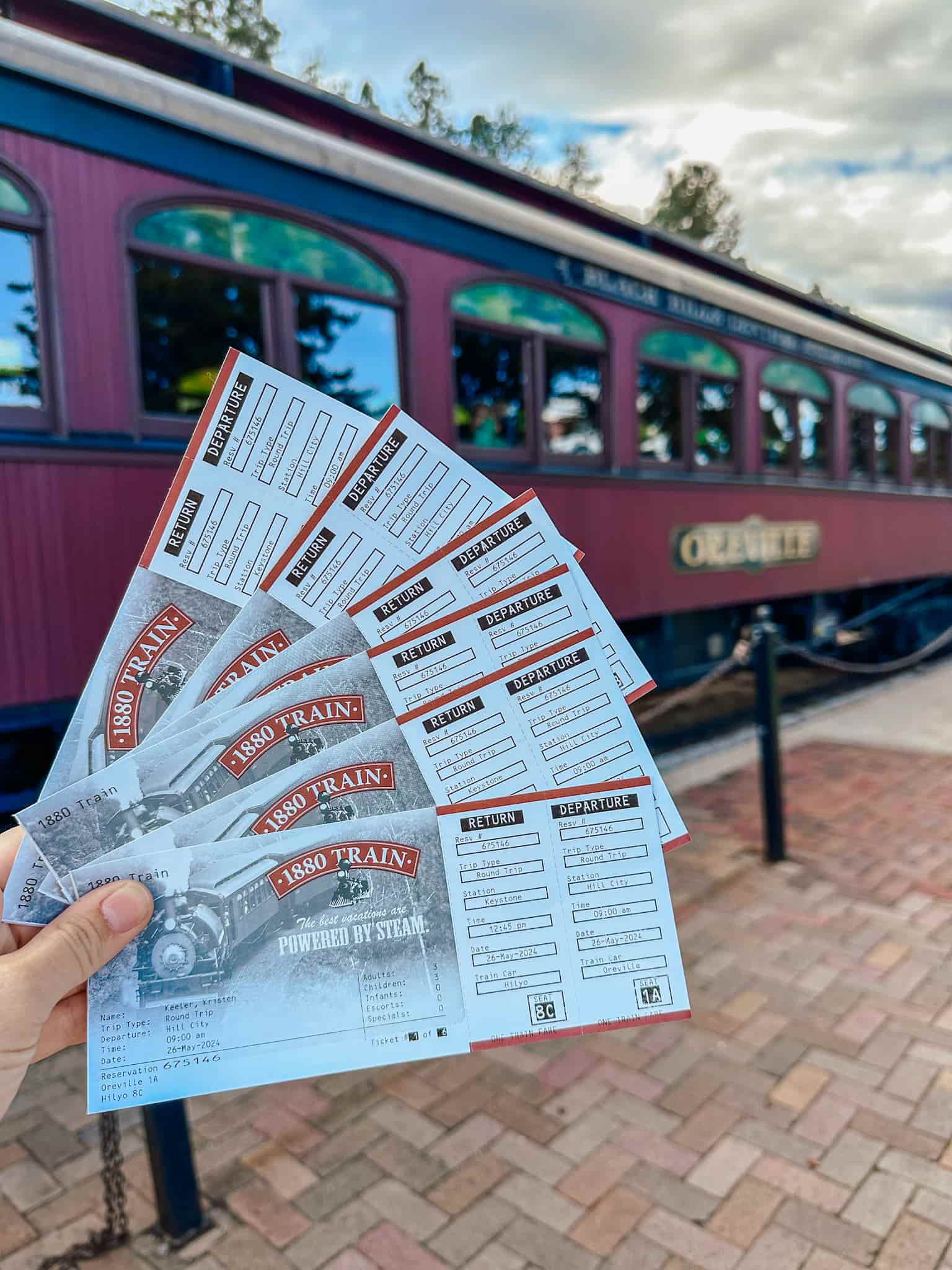 tickets in front of 1880's train of the black hills 