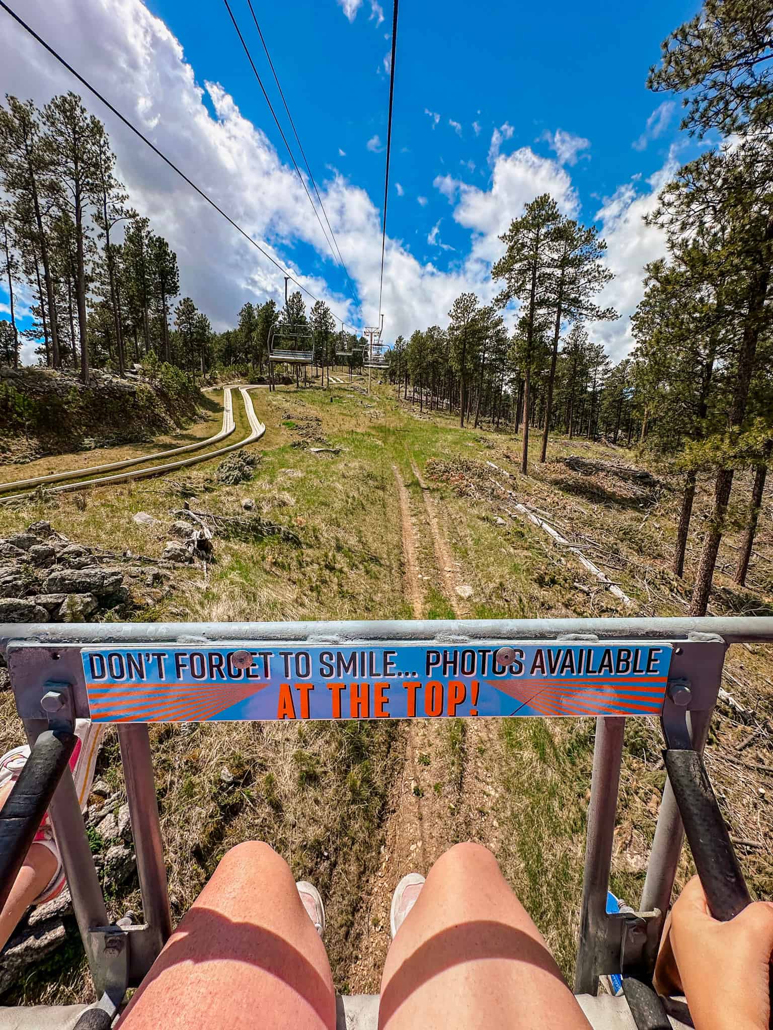 riding on the chair lift in the black hills of south dakota before traveling down the alpine slide 