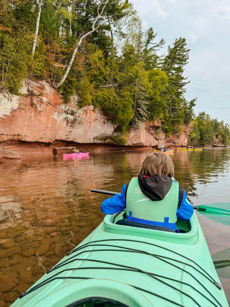 boy kayaking at apostle island national lakeshore