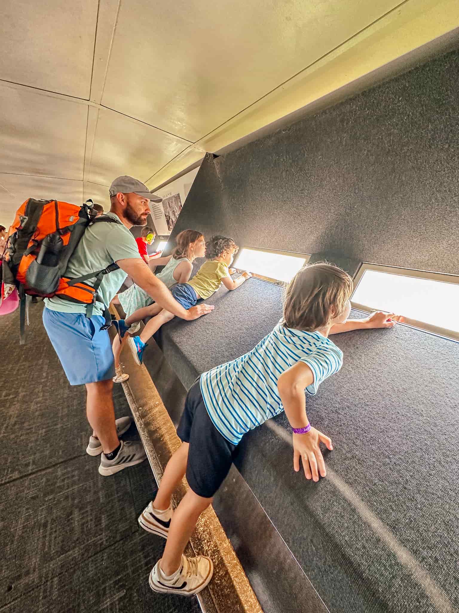 family looking out of window at gateway arch national park in st louis