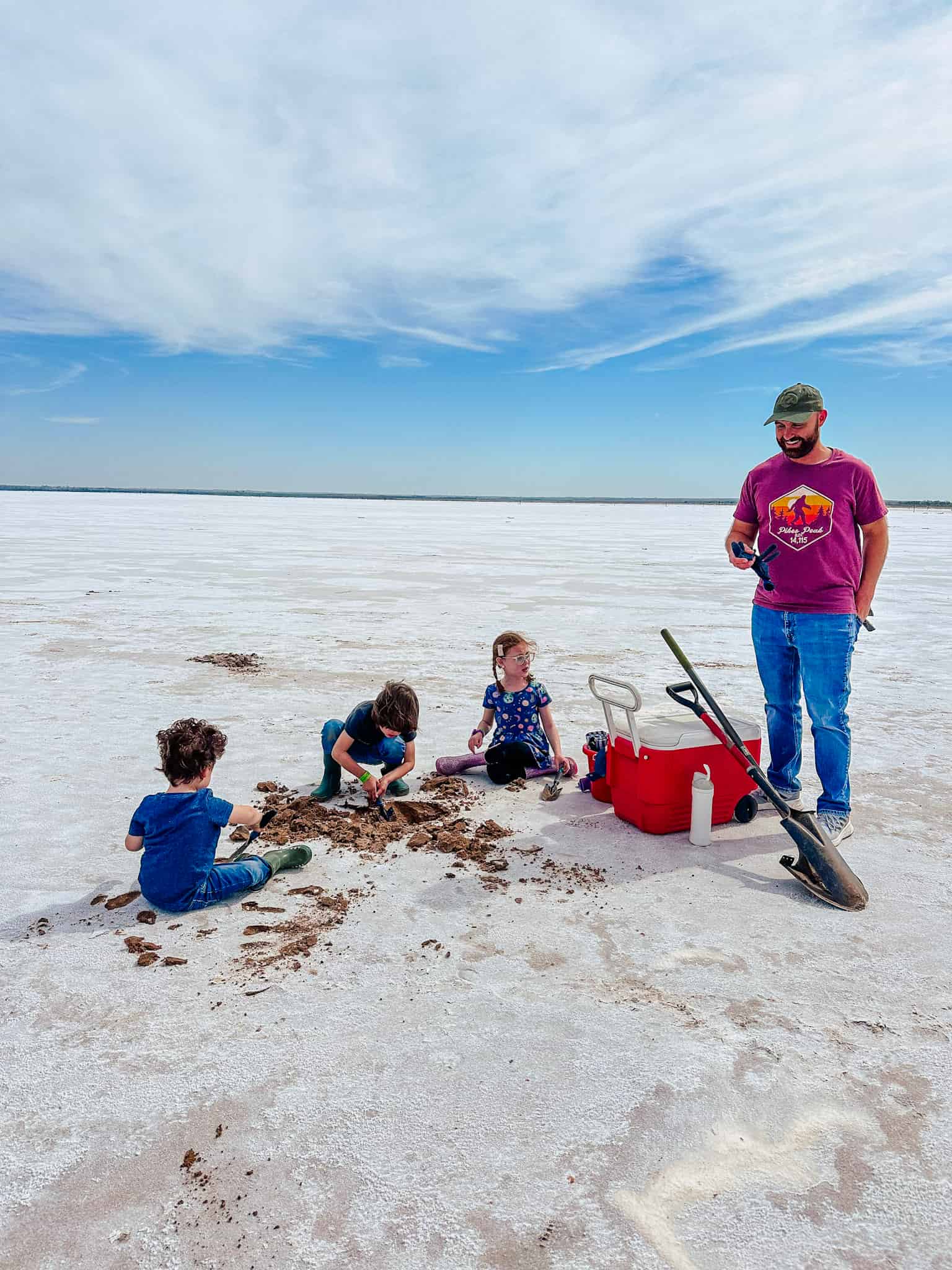 family digging for selenite crystals at great salt plains in jet oklahoma