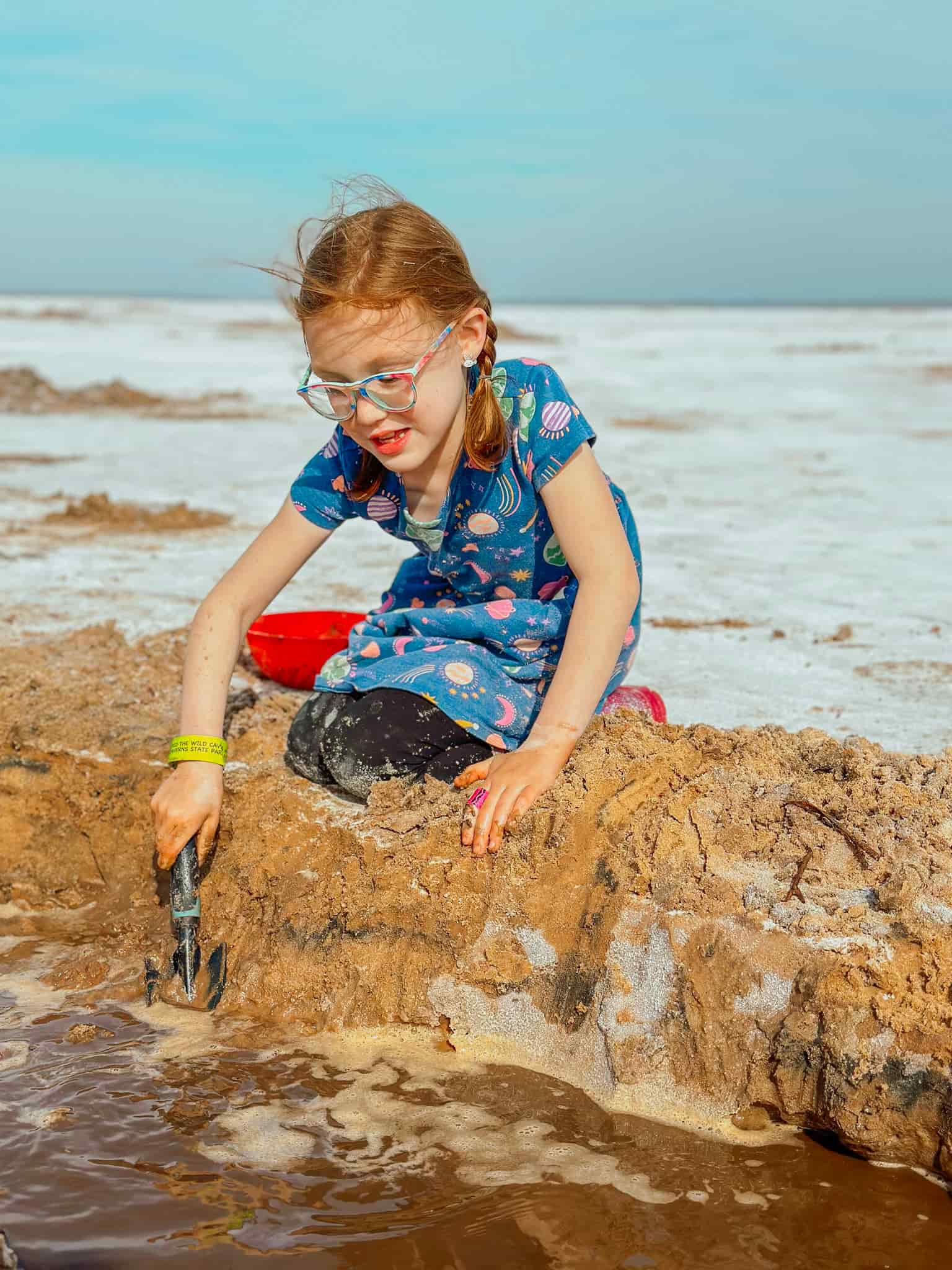 girl digging for selenite crystals at great salt plains 