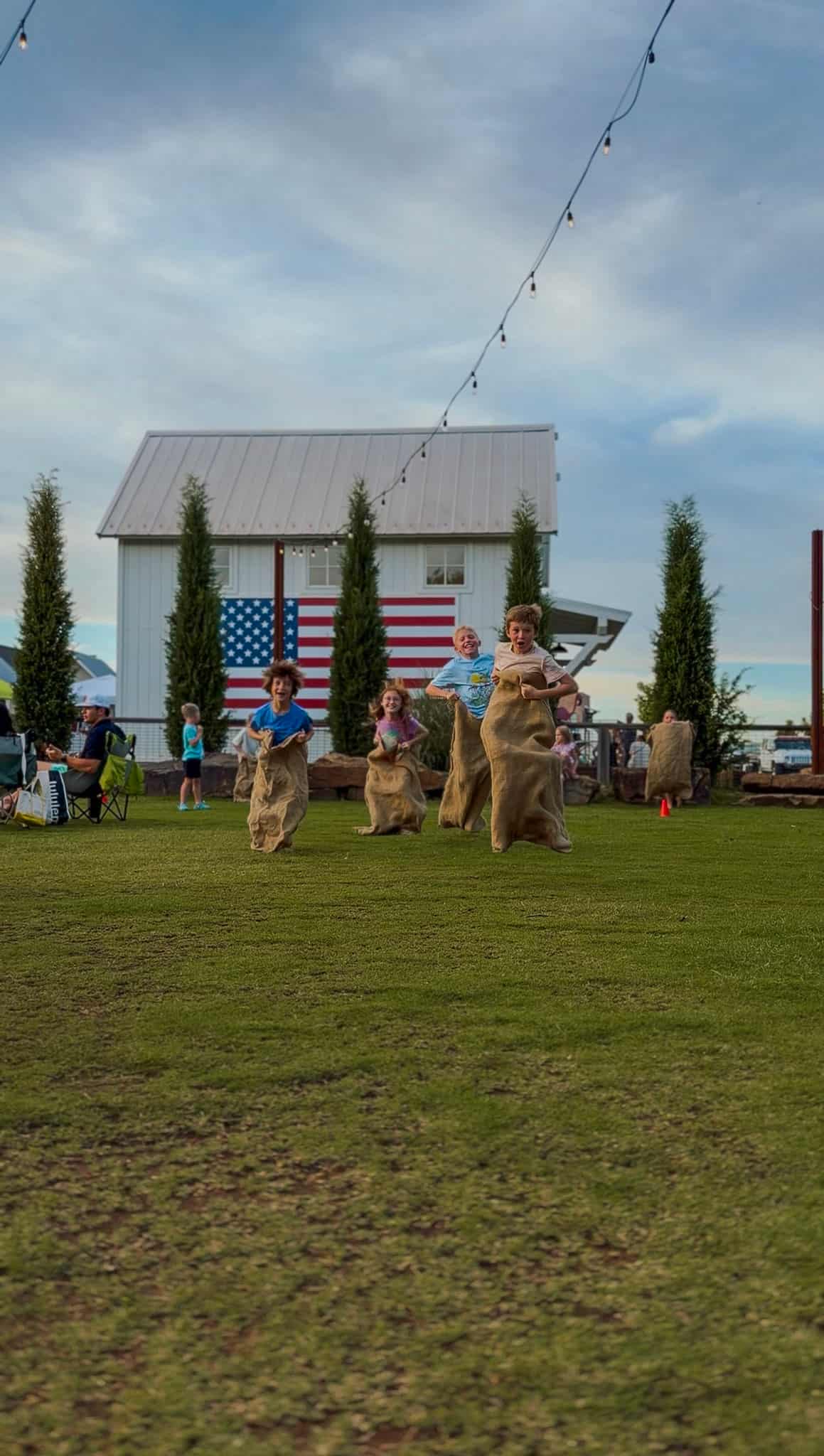 kids doing sack races in carlton landing