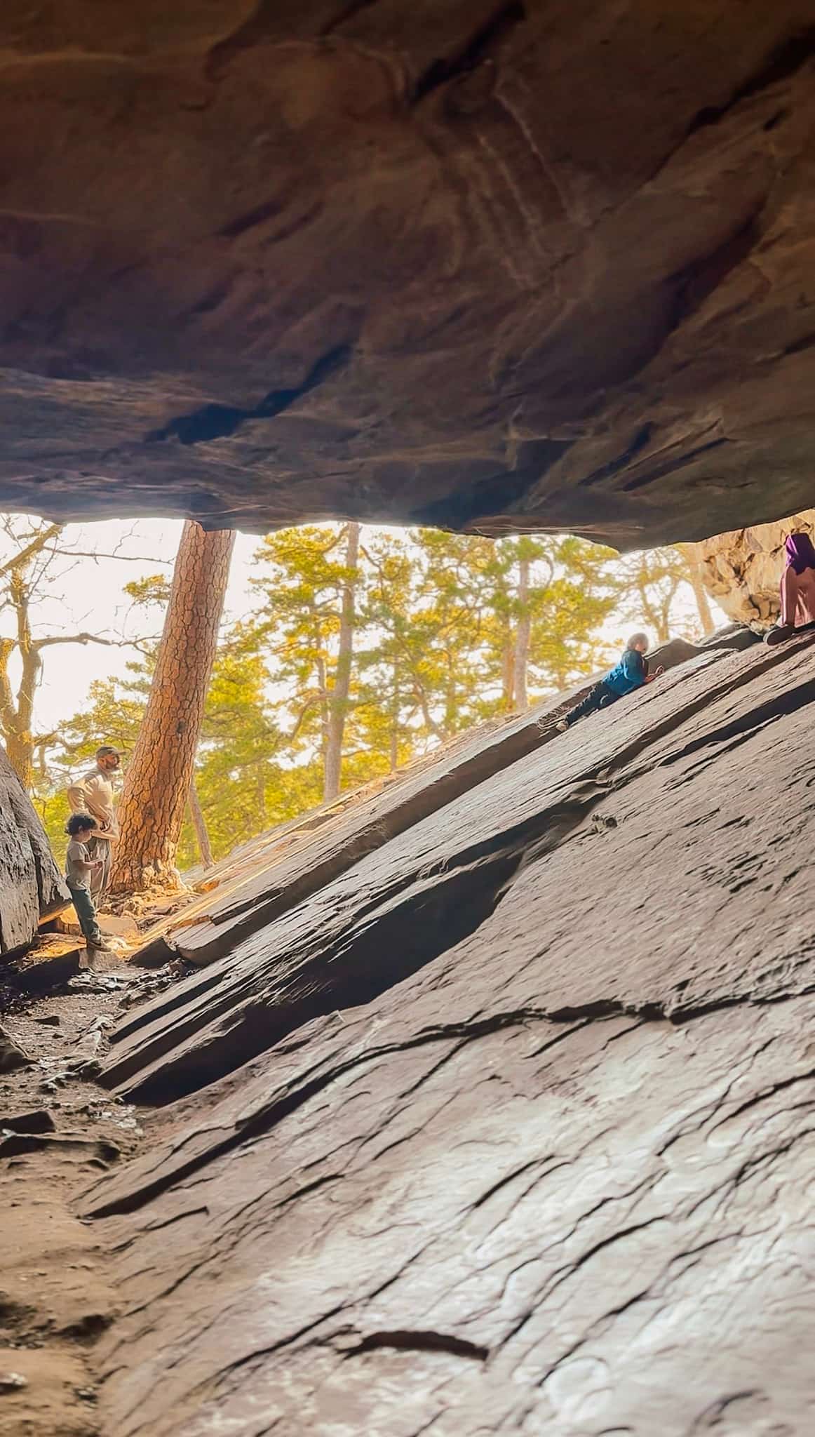 kids climbing through robbers cave 
